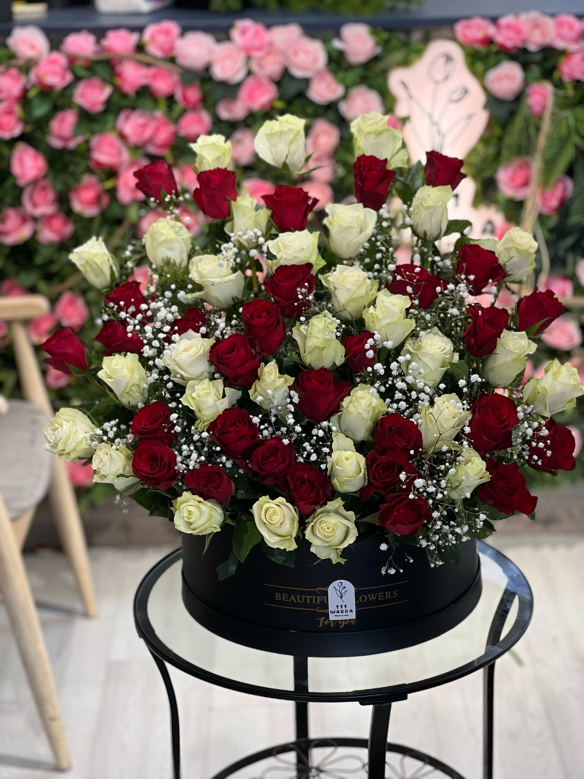 Red and White Roses in Black Round Box